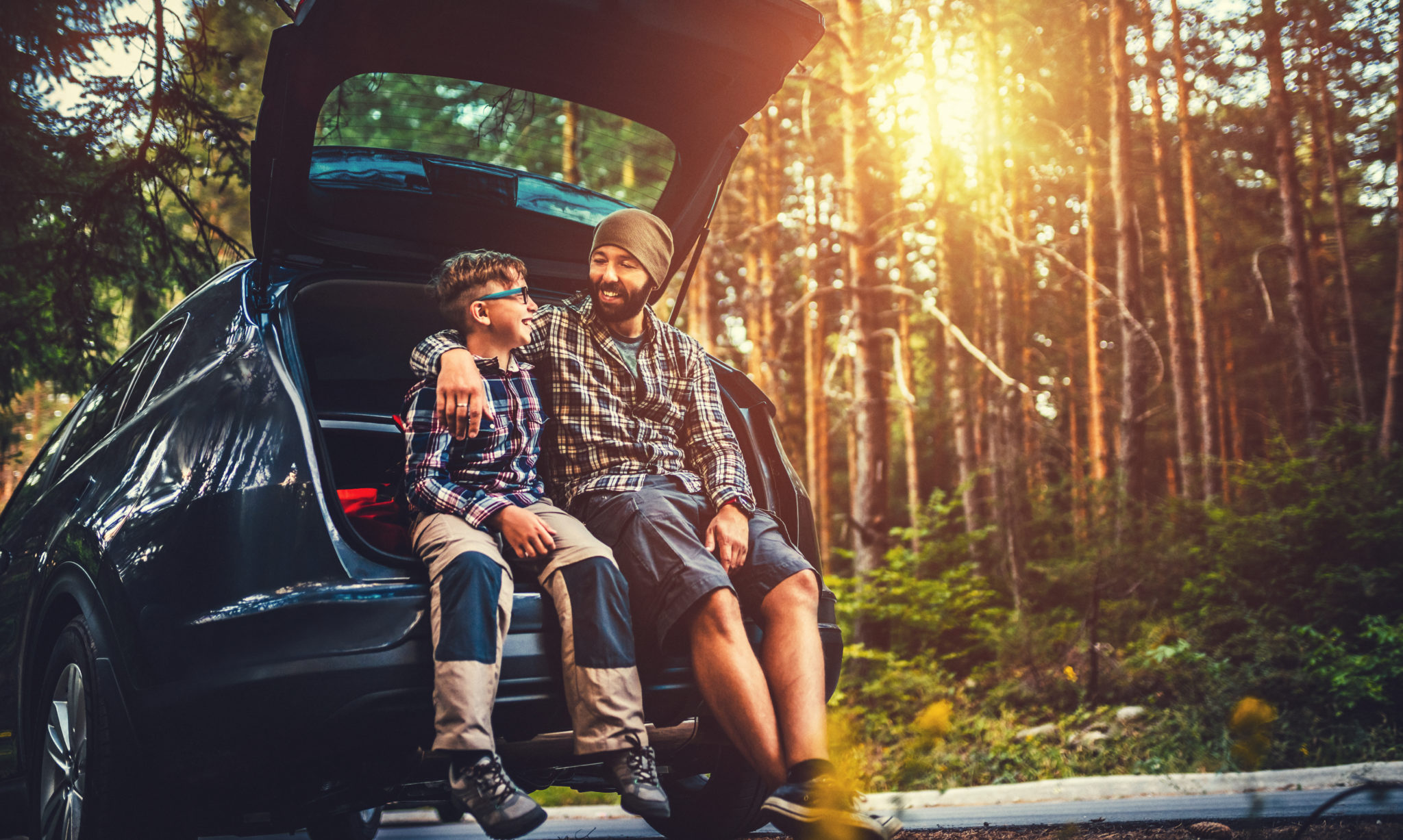 Father and son travelling by car